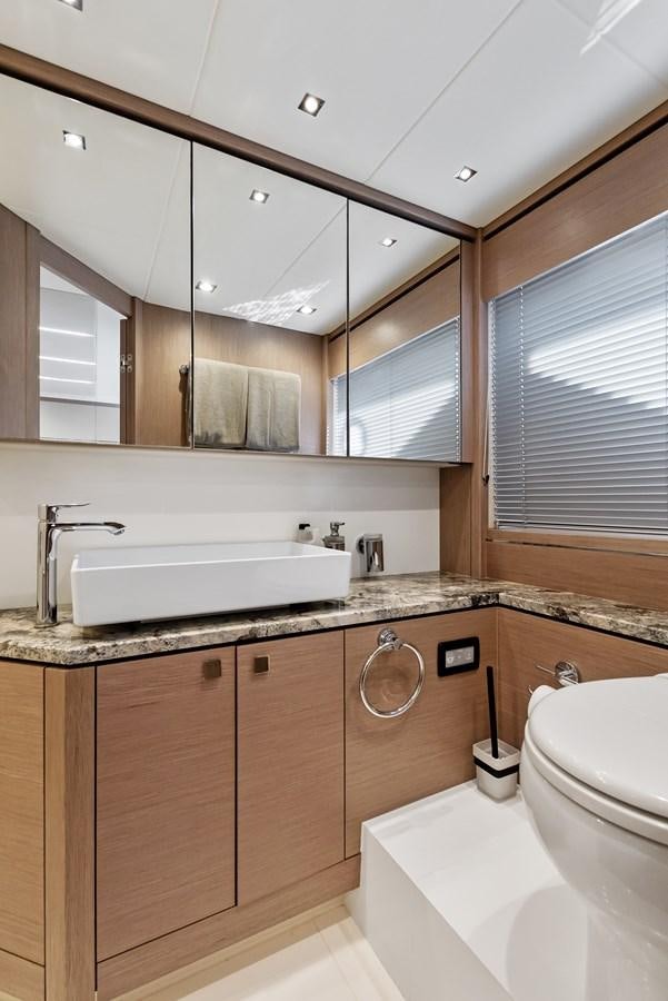 a bathroom with a sink and a toilet aboard IT'S A GIRL Yacht for Sale