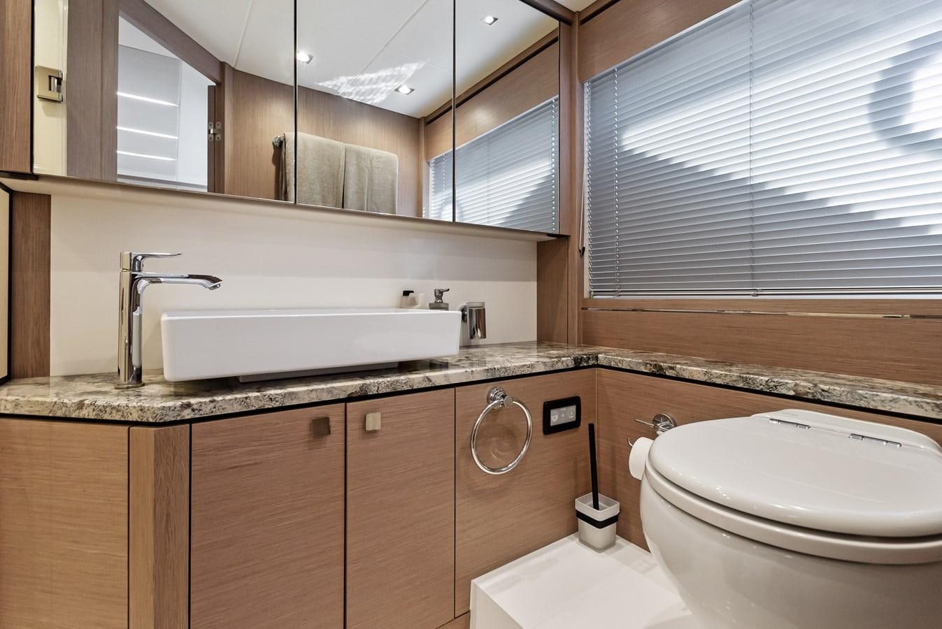 a bathroom with a sink and a toilet aboard IT'S A GIRL Yacht for Sale