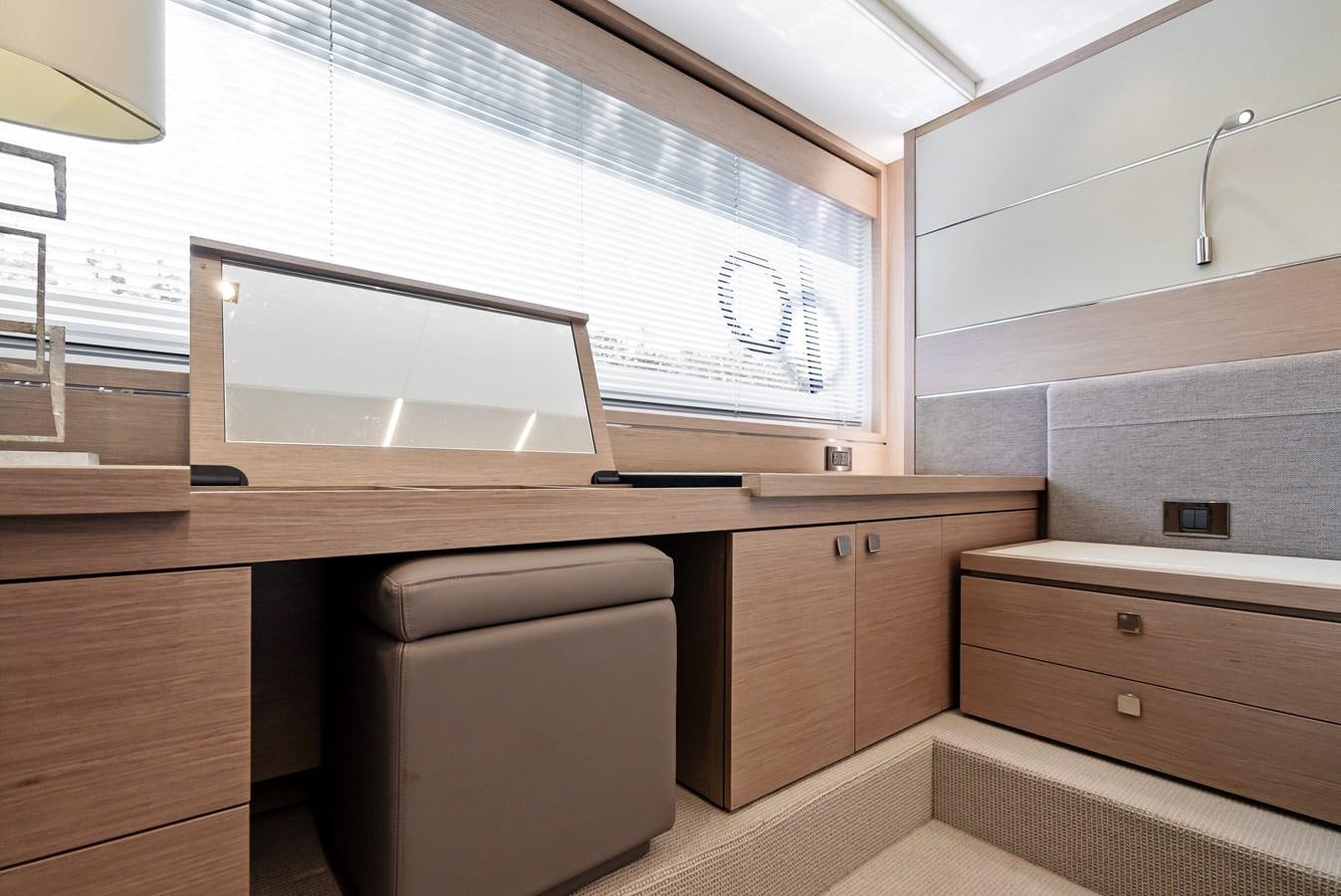 a room with a computer and a window aboard IT'S A GIRL Yacht for Sale