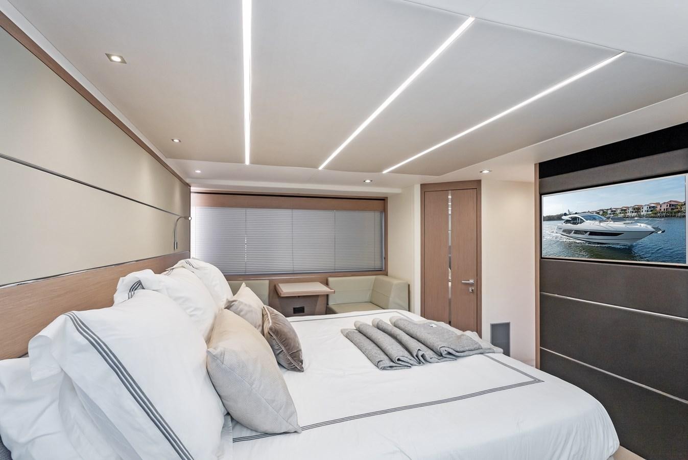 a room with a bed and a television aboard IT'S A GIRL Yacht for Sale