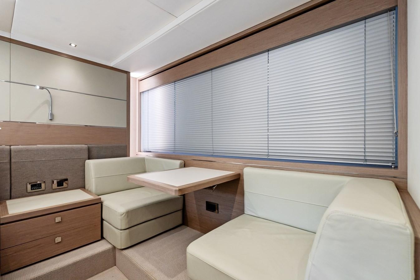 a room with a bed and a couch aboard IT'S A GIRL Yacht for Sale