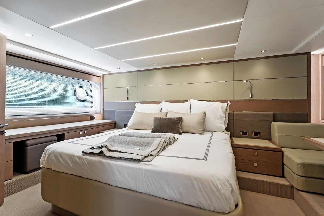 a room with a bed and a window aboard IT'S A GIRL Yacht for Sale
