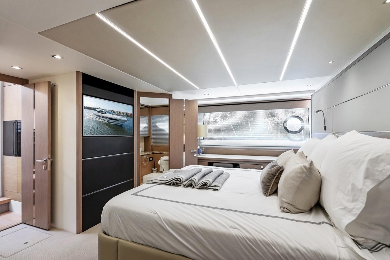a bedroom with a large bed aboard IT'S A GIRL Yacht for Sale