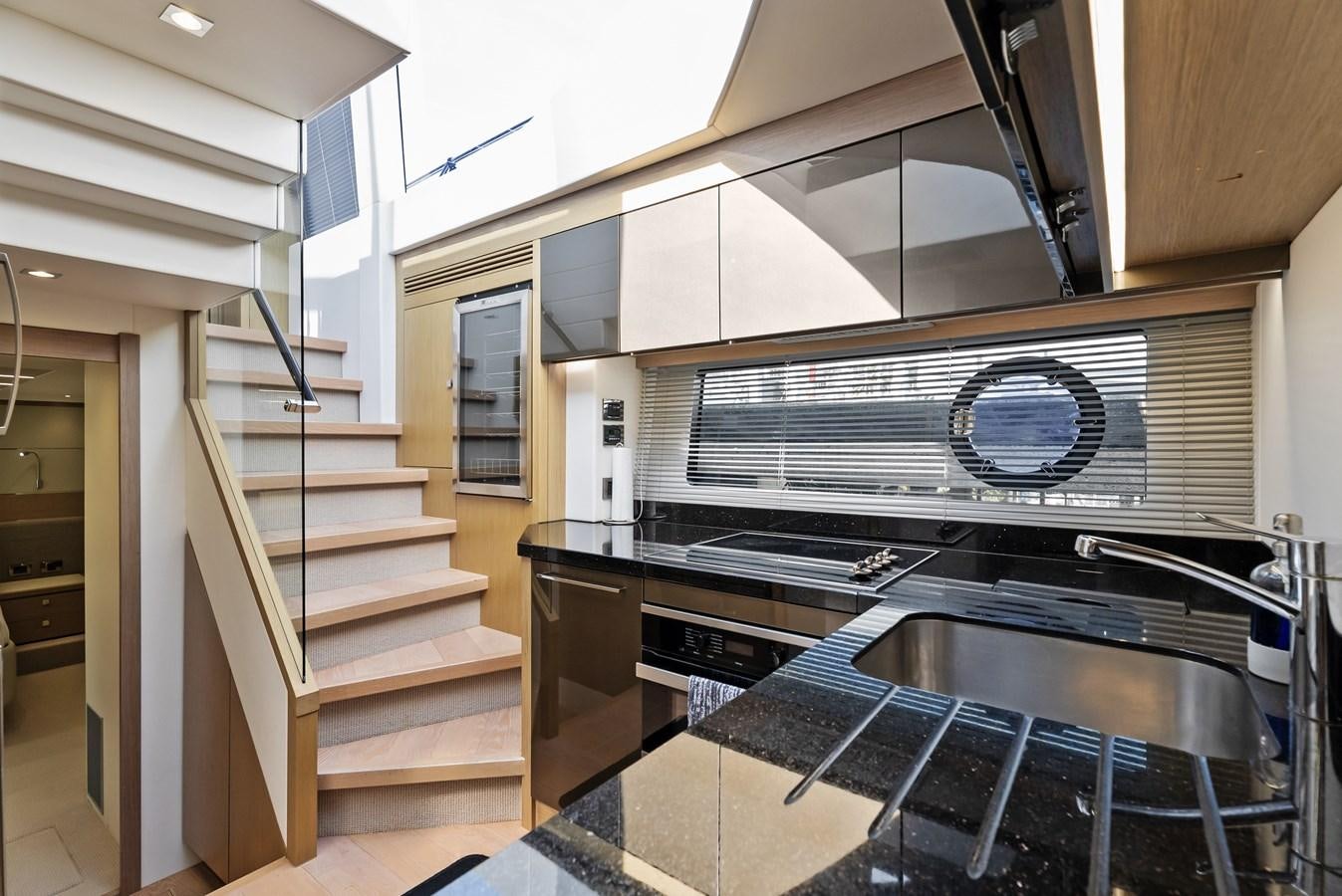 a kitchen with a stove and a microwave aboard IT'S A GIRL Yacht for Sale