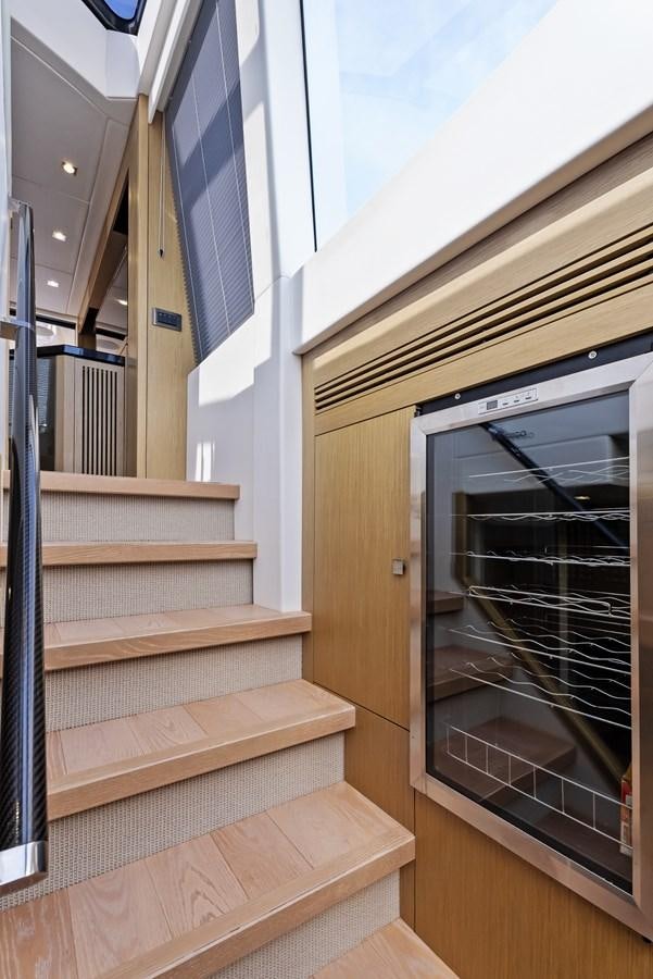a staircase with a glass door aboard IT'S A GIRL Yacht for Sale