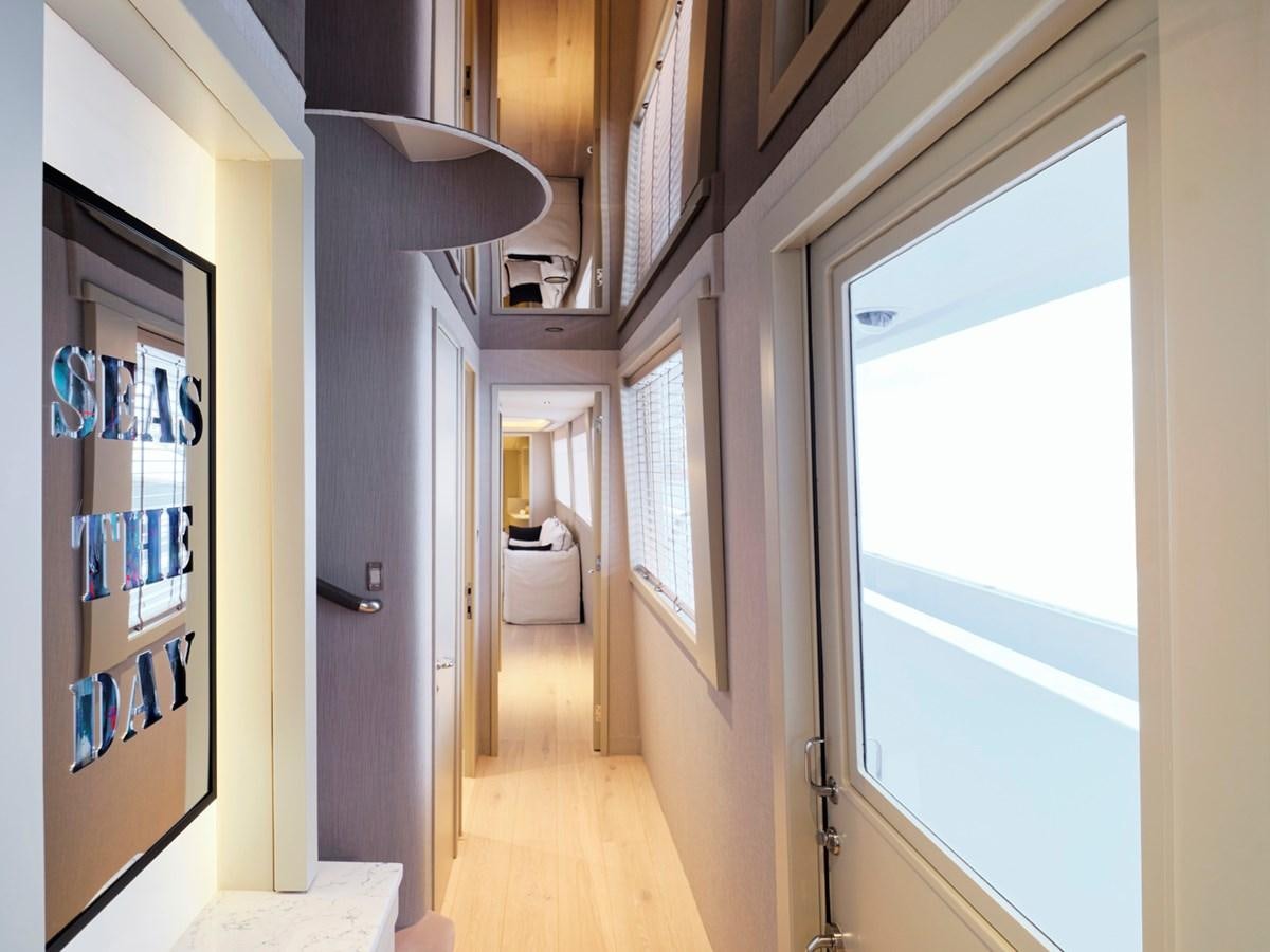 a hallway with a window and a door aboard ENDLESS SUMMER Yacht for Sale