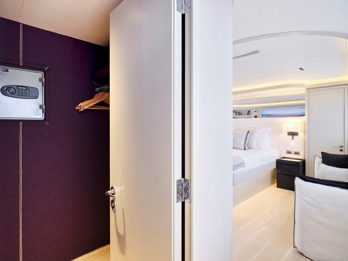 a room with a bed and a television aboard ENDLESS SUMMER Yacht for Sale