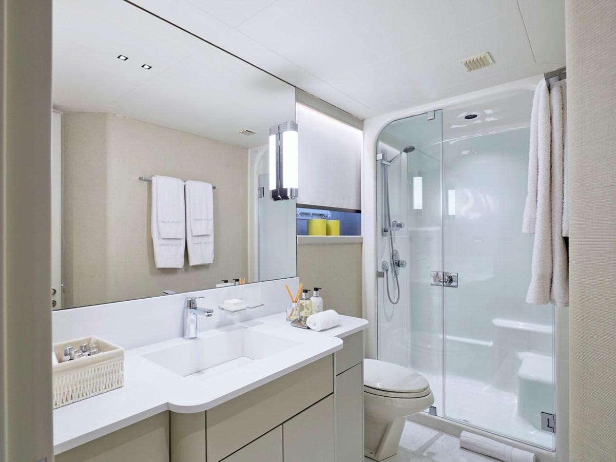 a bathroom with a glass shower aboard ENDLESS SUMMER Yacht for Sale