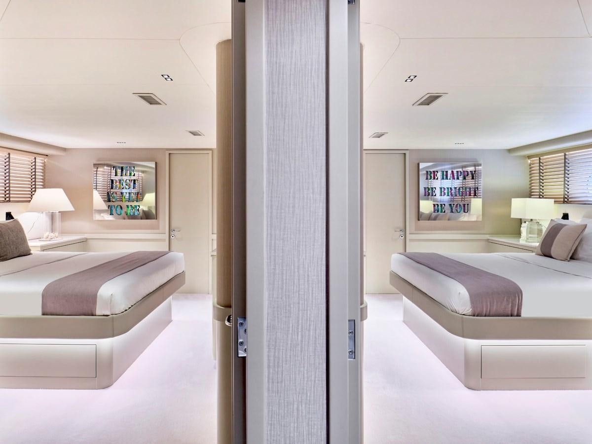 a room with a bed and a couch aboard ENDLESS SUMMER Yacht for Sale