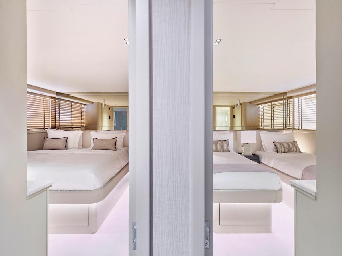 a room with a bed and a window aboard ENDLESS SUMMER Yacht for Sale