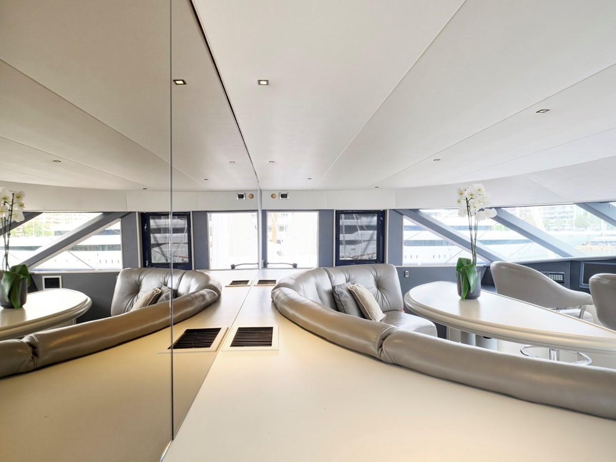 a room with a couch and a table aboard ENDLESS SUMMER Yacht for Sale