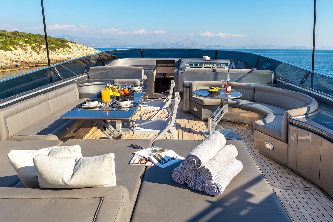 a room with a table and chairs on it aboard SUMMER FUN Yacht for Sale