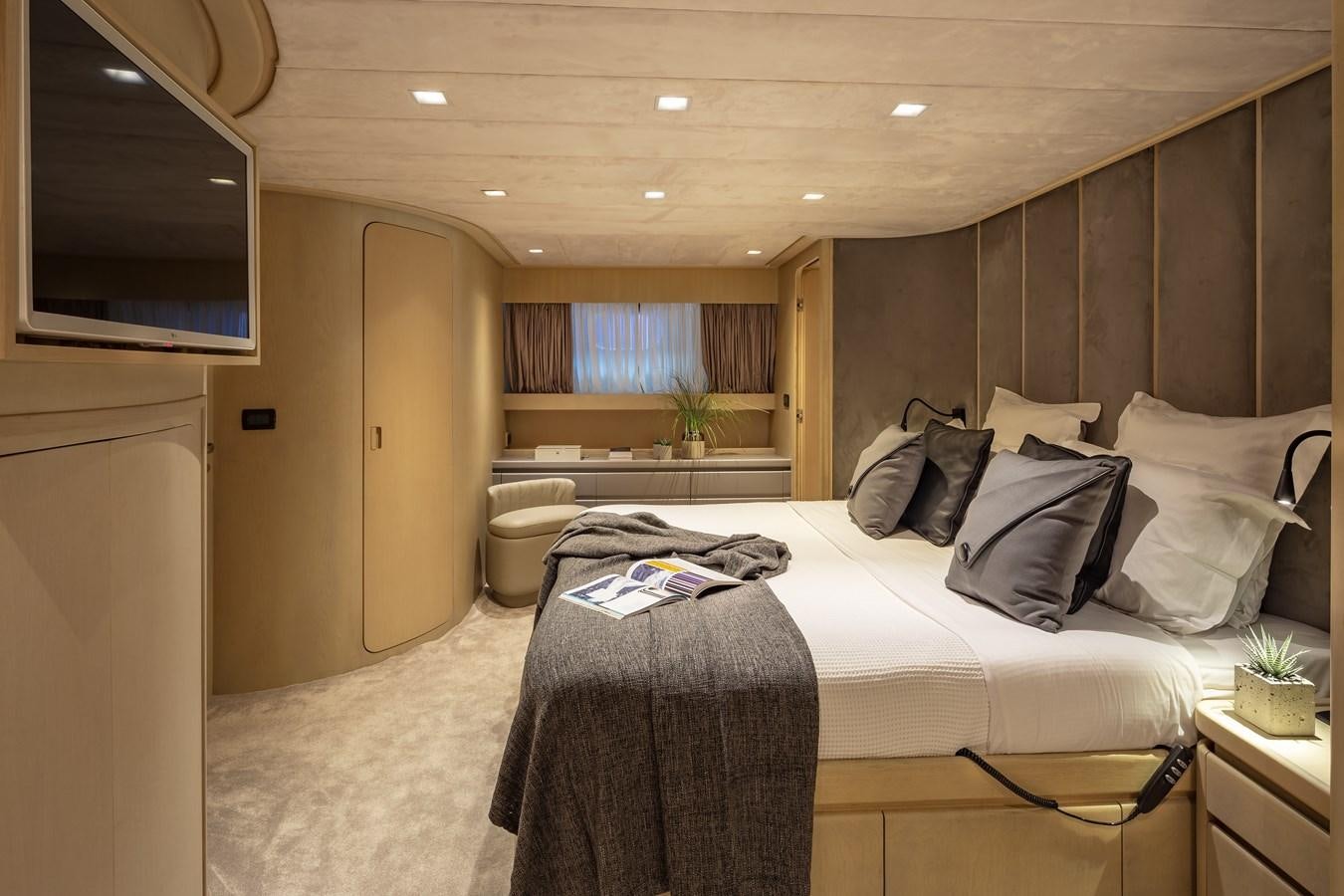 a bedroom with a bed and a desk aboard SUMMER FUN Yacht for Sale