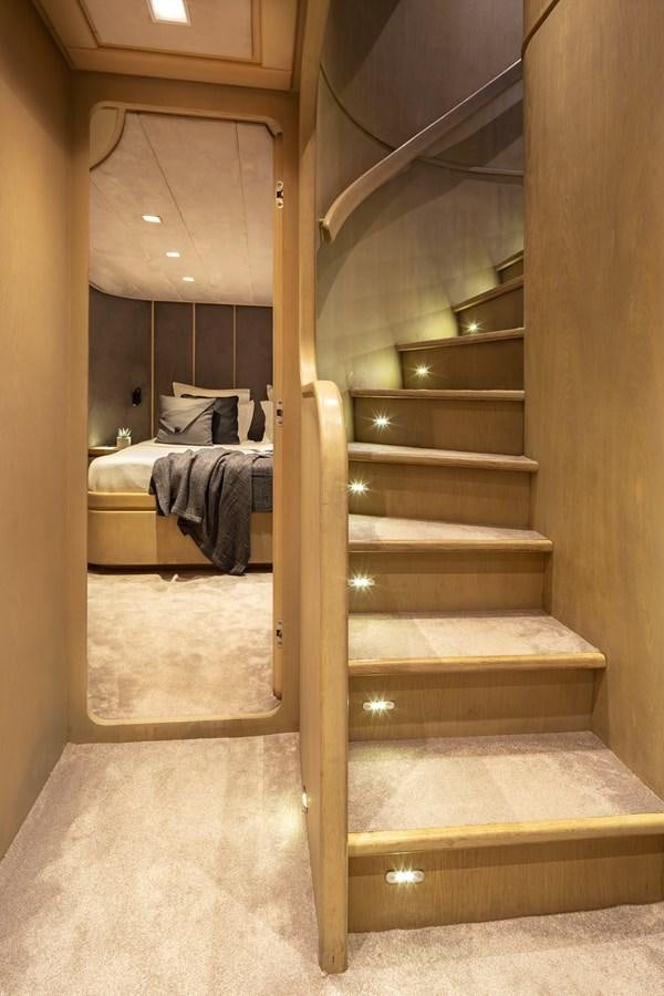 a wooden staircase in a room aboard SUMMER FUN Yacht for Sale