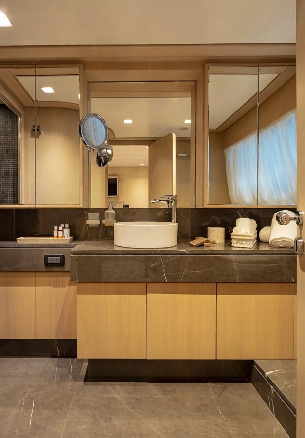 a bathroom with a large mirror aboard SUMMER FUN Yacht for Sale