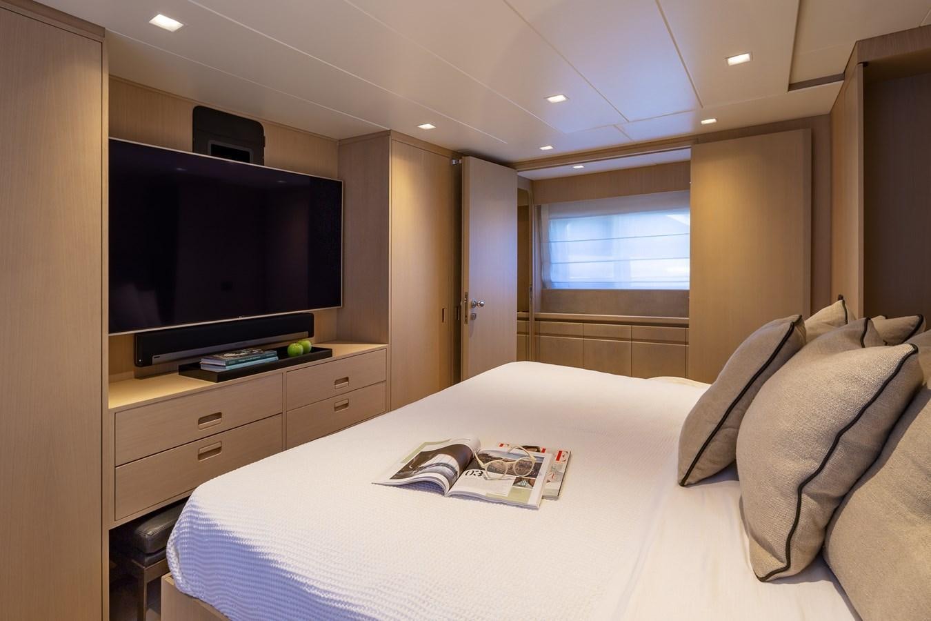 a hotel room with a bed and tv aboard SUMMER FUN Yacht for Sale