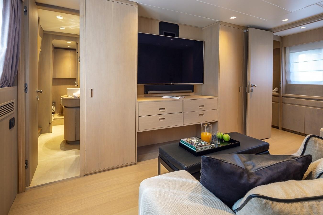 a living room with a tv and a couch aboard SUMMER FUN Yacht for Sale