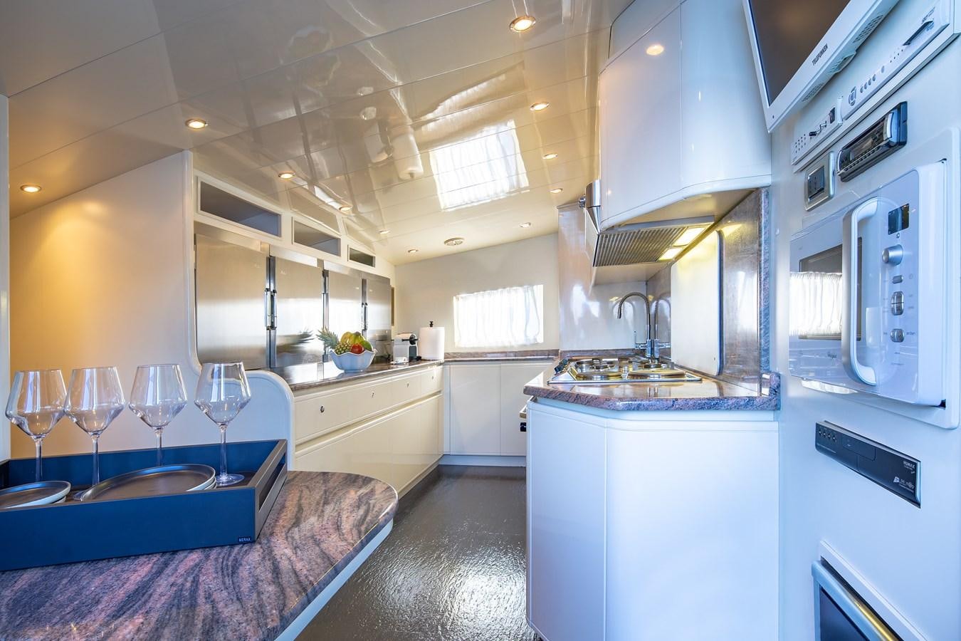 a kitchen with a large window aboard SUMMER FUN Yacht for Sale