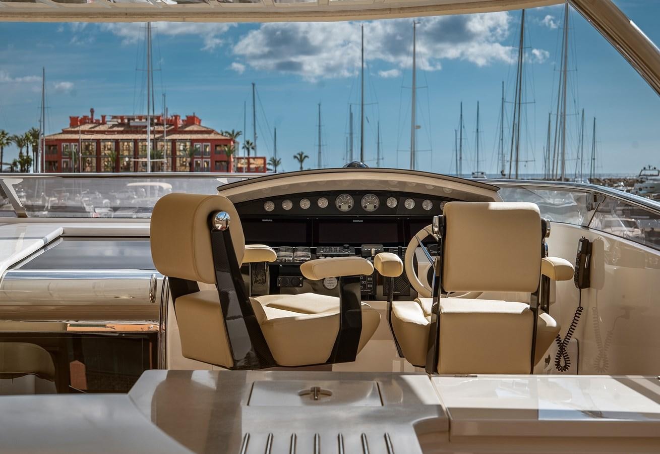 a boat with seats and a table aboard LADY M Yacht for Sale