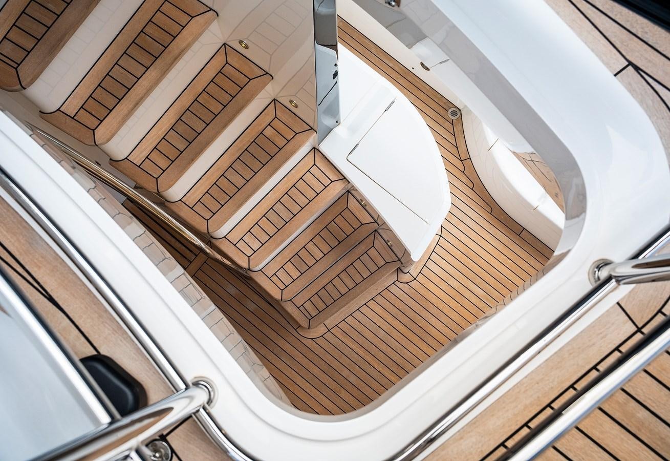 a white car with a wooden door aboard LADY M Yacht for Sale