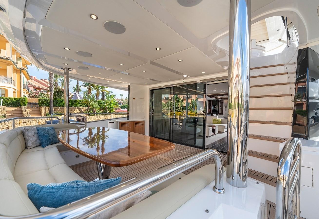 a large room with a table and chairs aboard LADY M Yacht for Sale