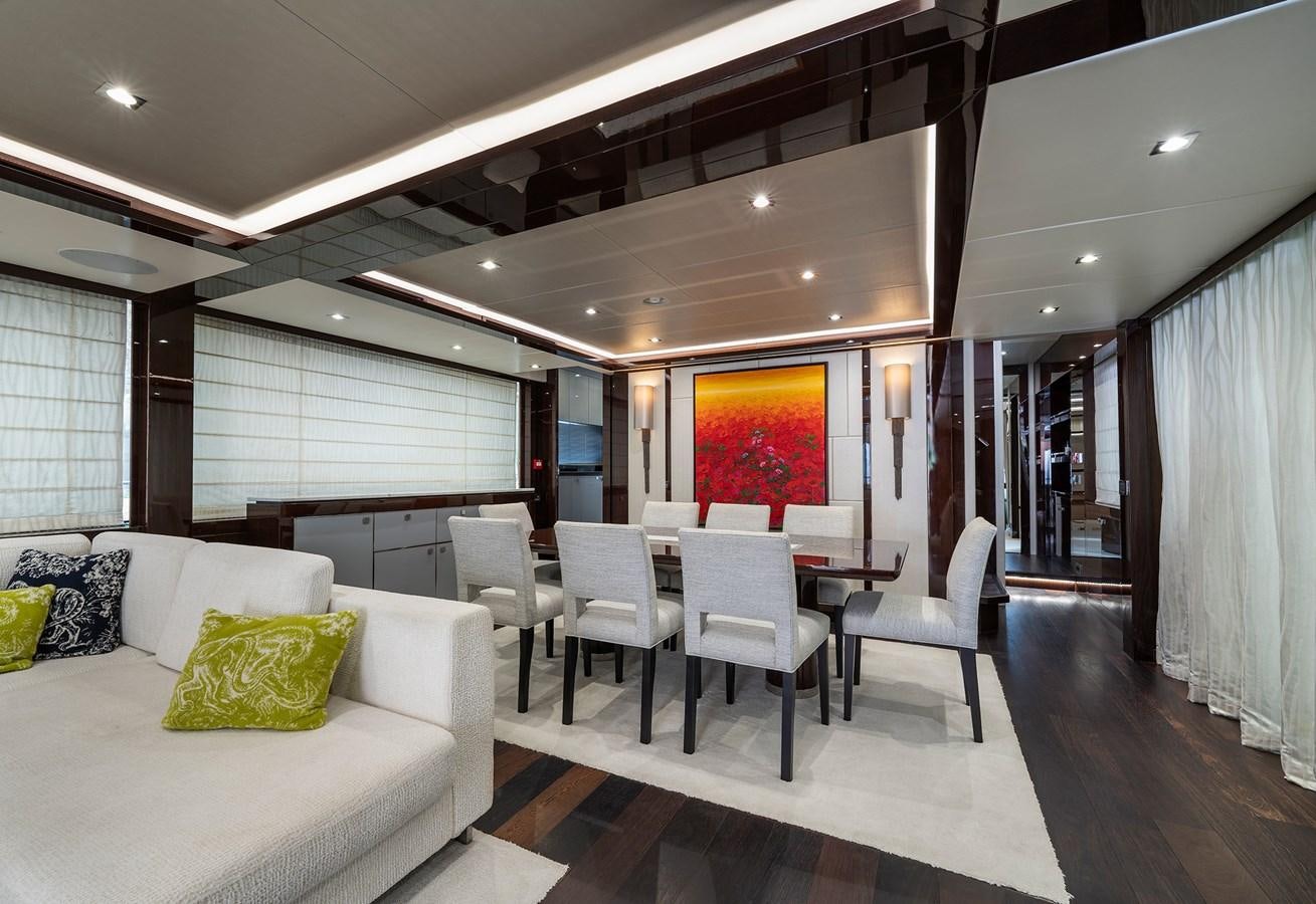 a room with a table chairs and a couch aboard LADY M Yacht for Sale