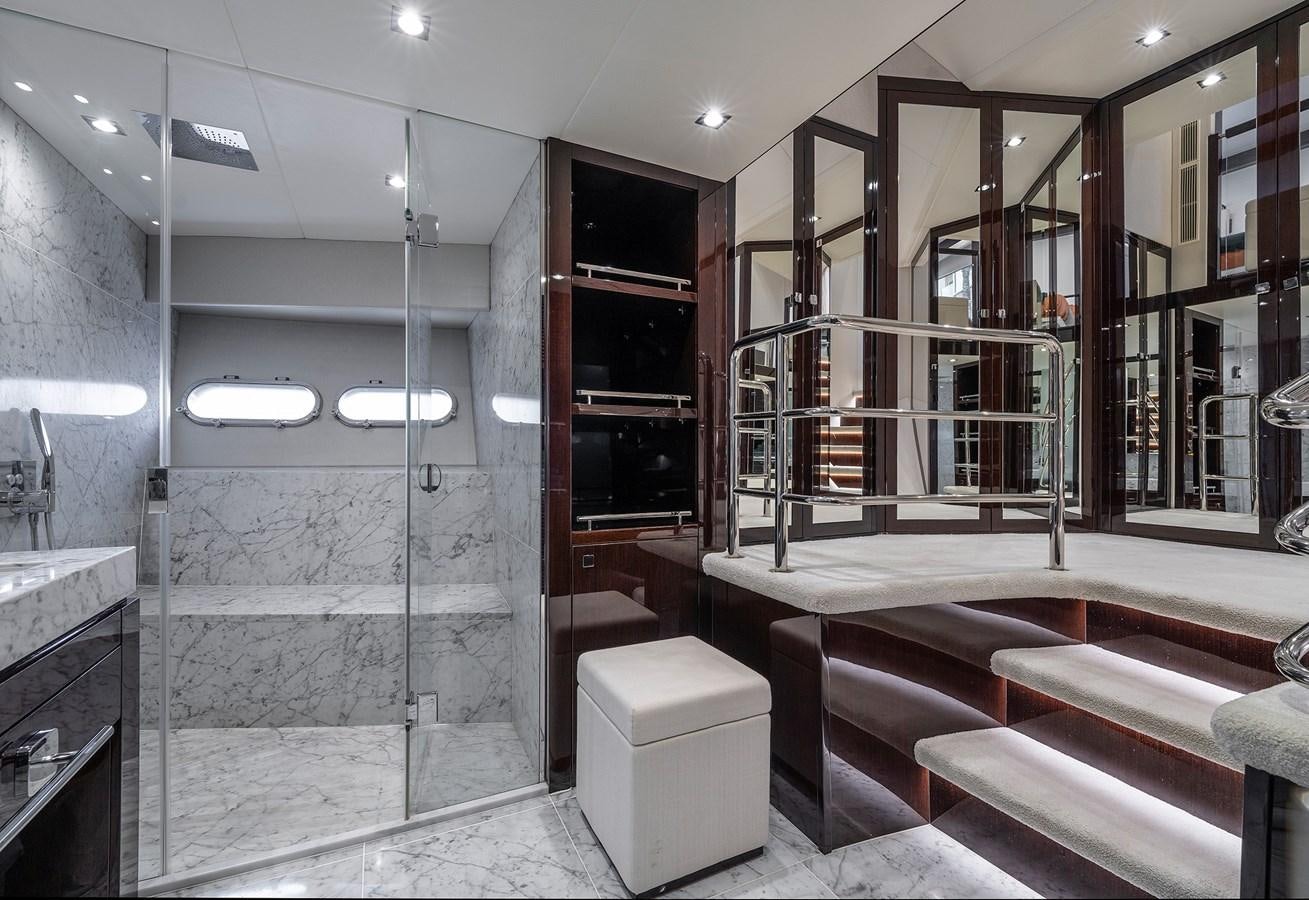 a bathroom with a glass shower aboard LADY M Yacht for Sale