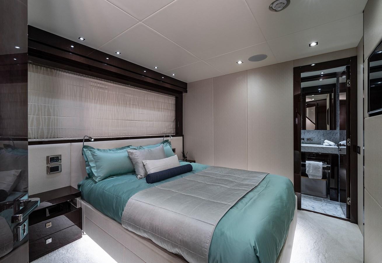 a bed in a room aboard LADY M Yacht for Sale