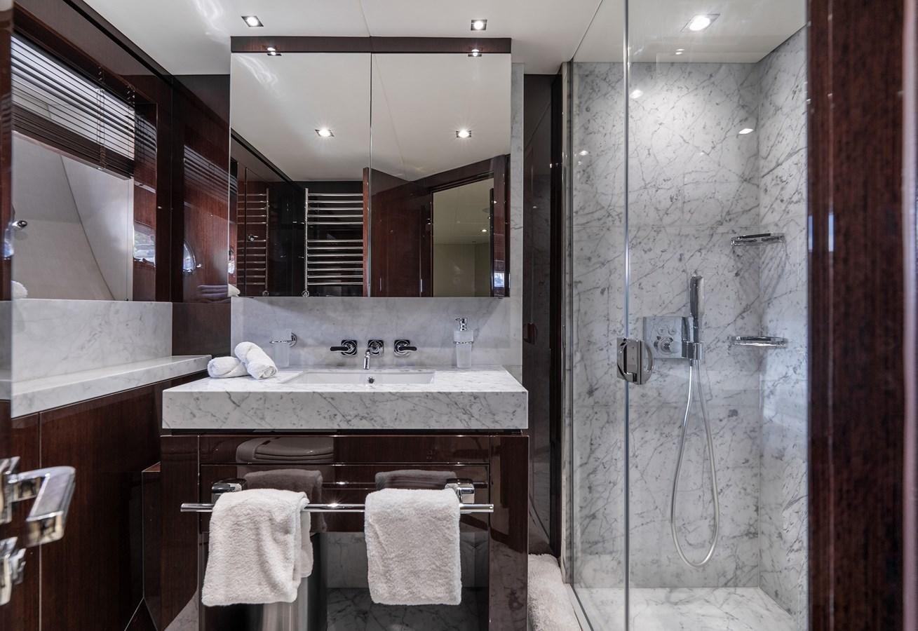 a bathroom with a large mirror aboard LADY M Yacht for Sale