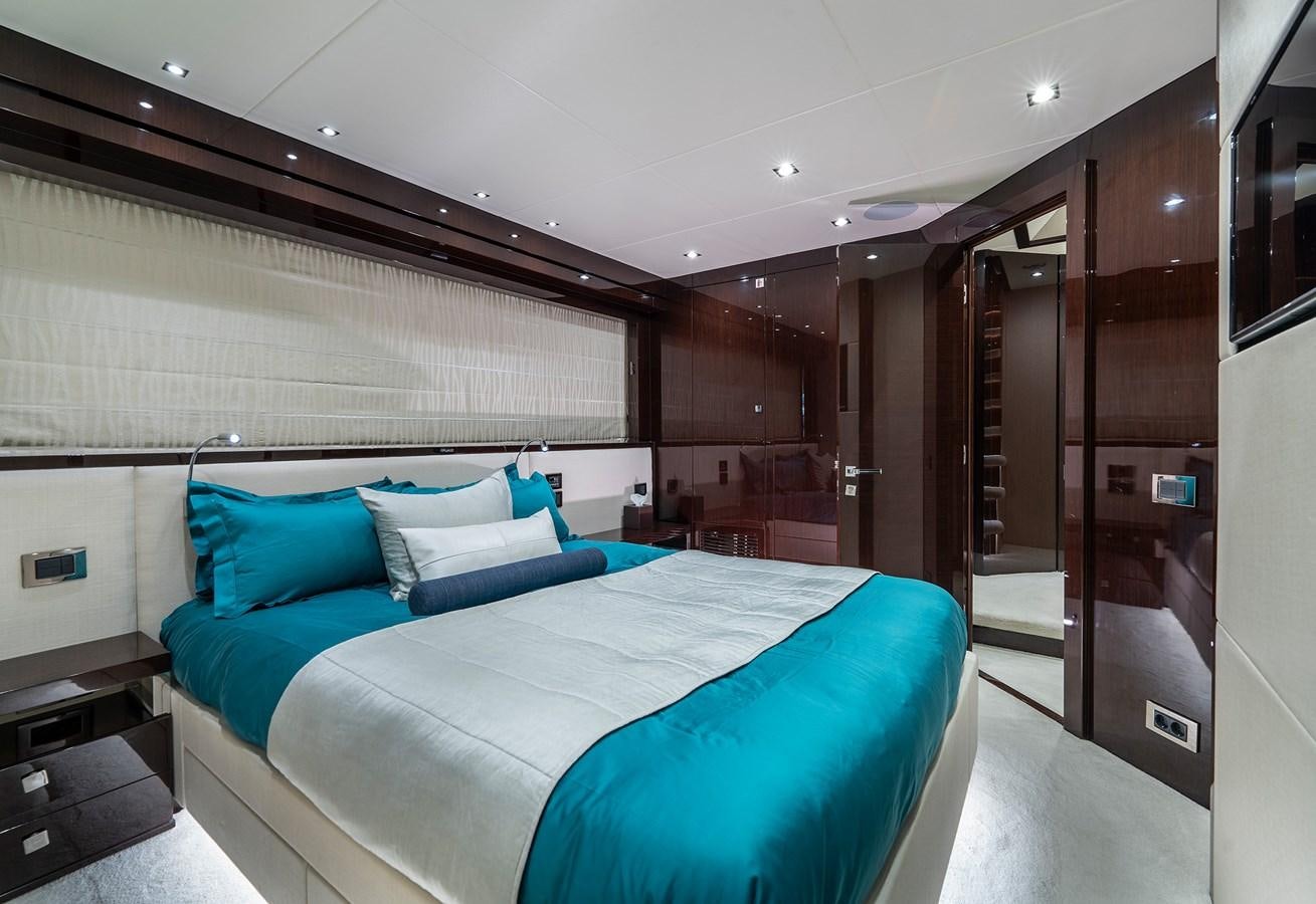 a bed in a room aboard LADY M Yacht for Sale