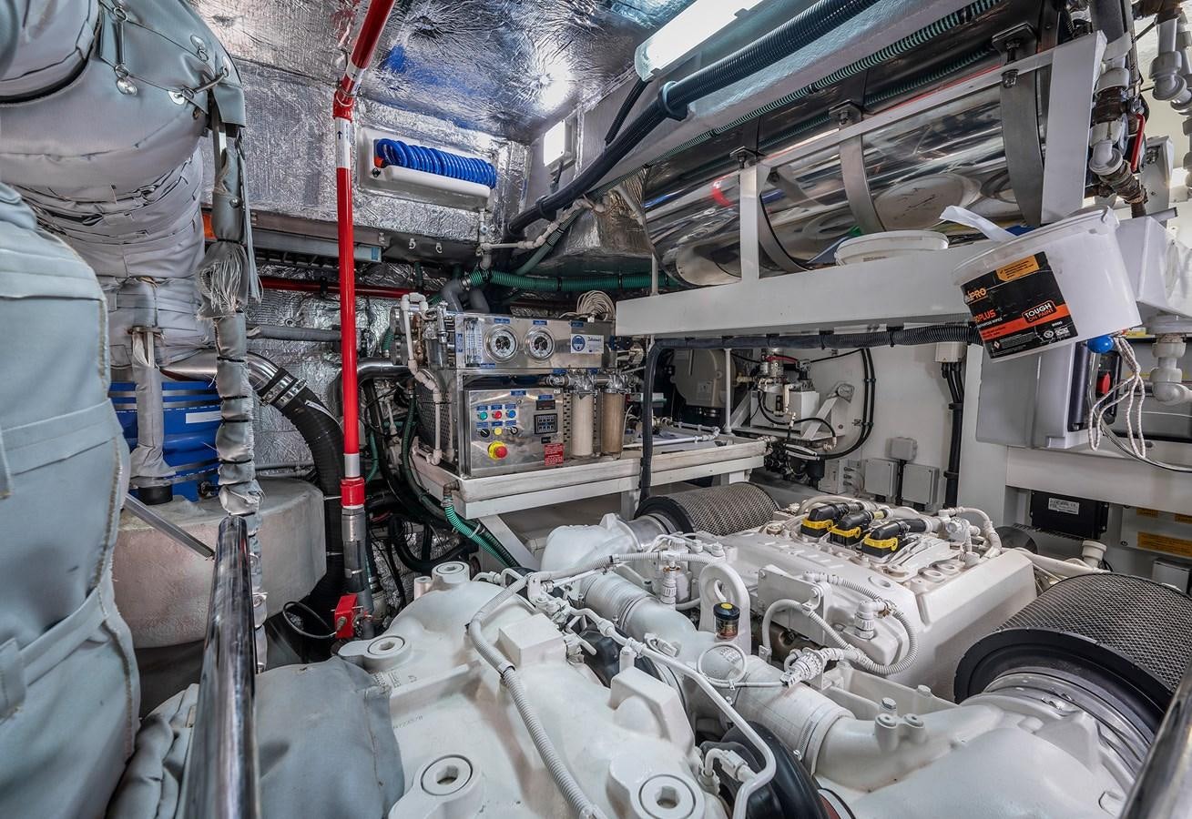 a room with a large group of pipes and machinery aboard LADY M Yacht for Sale