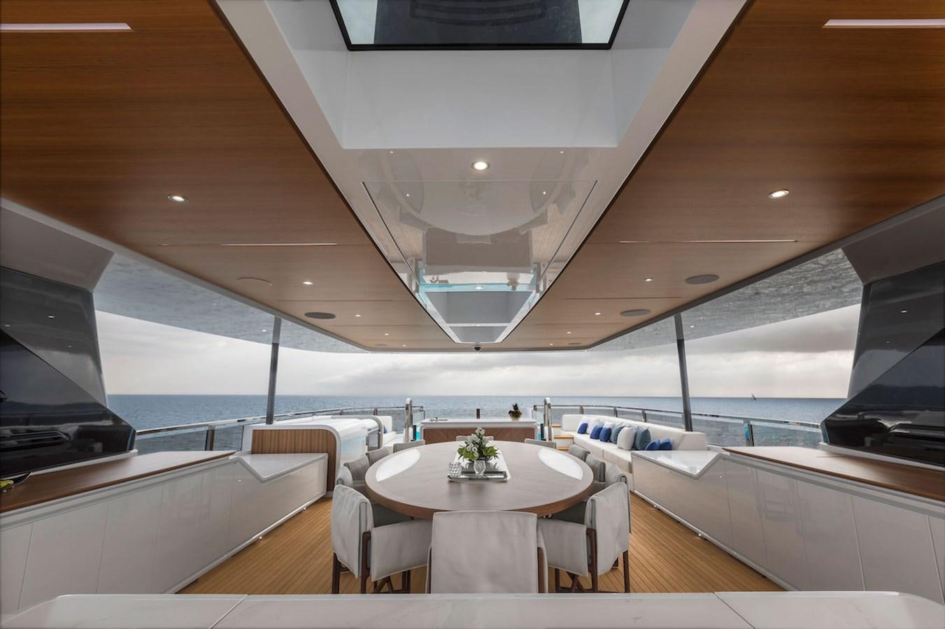 a room with a table and chairs aboard MAVERICK Yacht for Sale