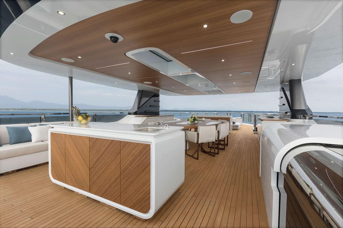 a room with a large white table and chairs and a large window aboard MAVERICK Yacht for Sale
