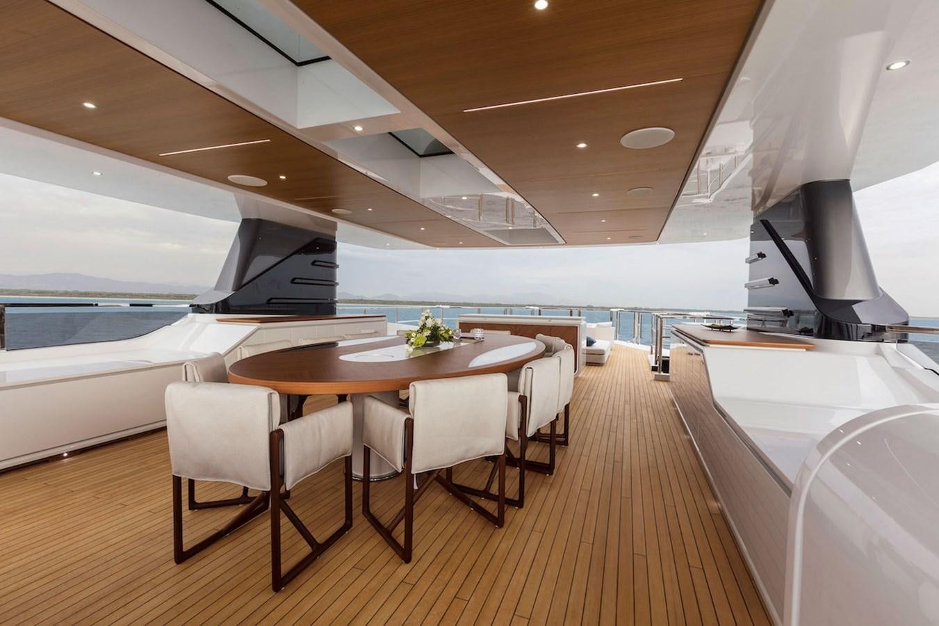 a room with a table and chairs aboard MAVERICK Yacht for Sale