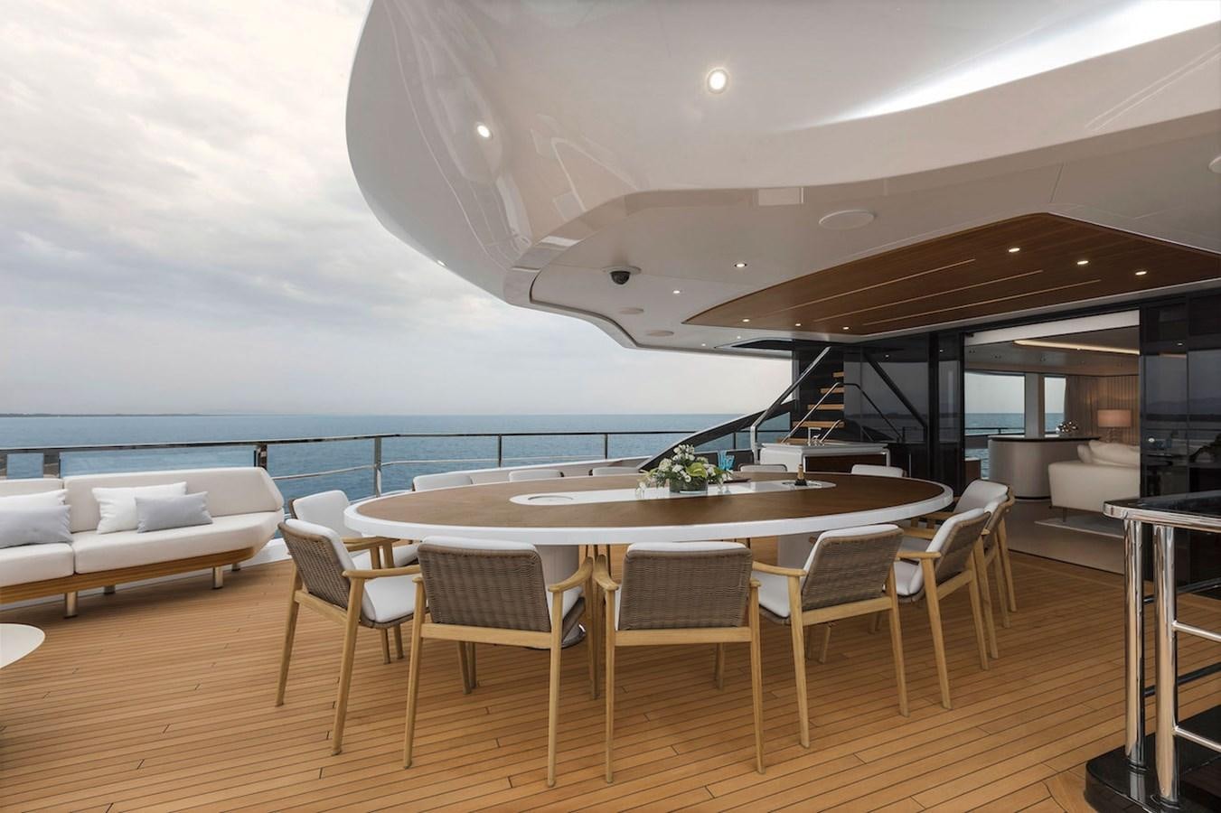 a room with a table and chairs aboard MAVERICK Yacht for Sale