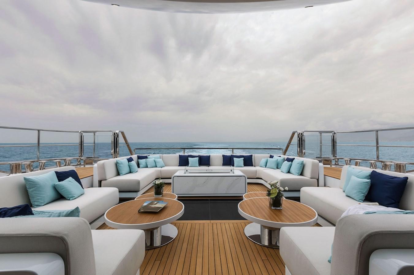 a living room with a large balcony aboard MAVERICK Yacht for Sale