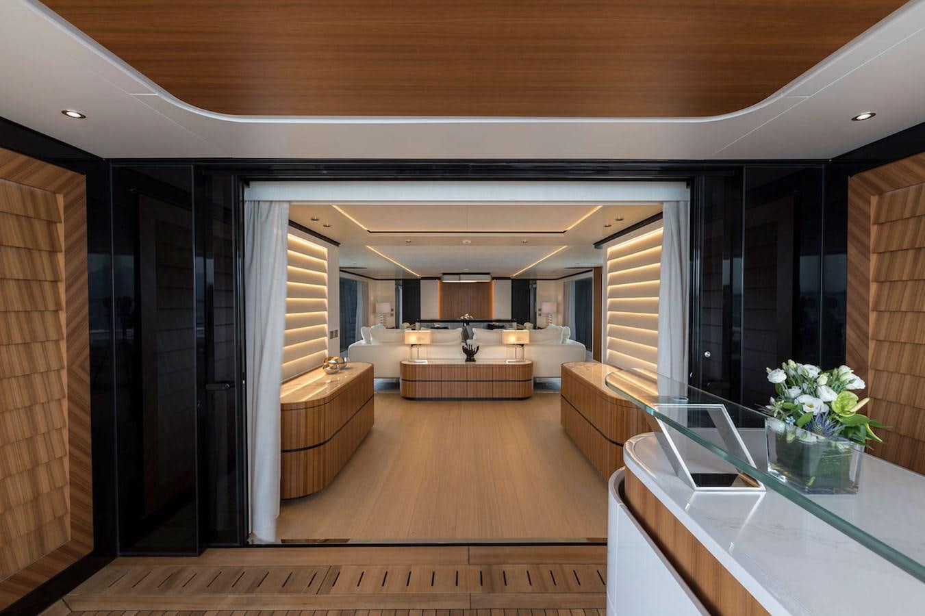 a large room with a large glass table and a large window aboard MAVERICK Yacht for Sale