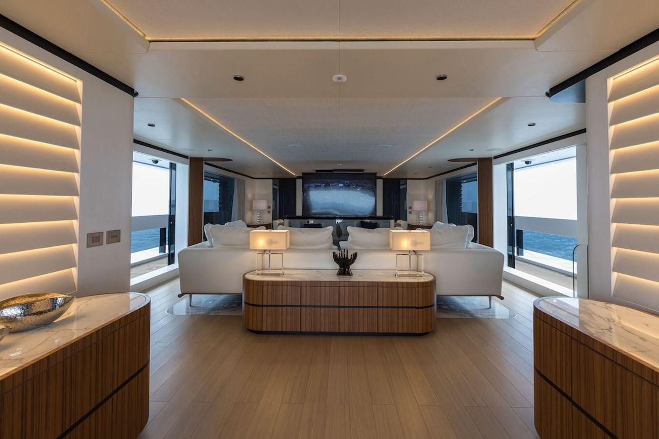 a room with a table and a couch aboard MAVERICK Yacht for Sale