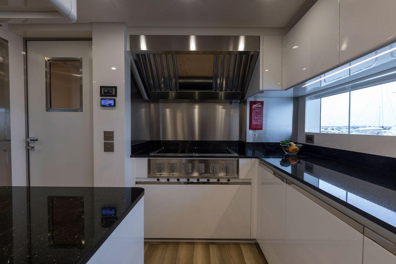 a kitchen with a stove and oven aboard MAVERICK Yacht for Sale