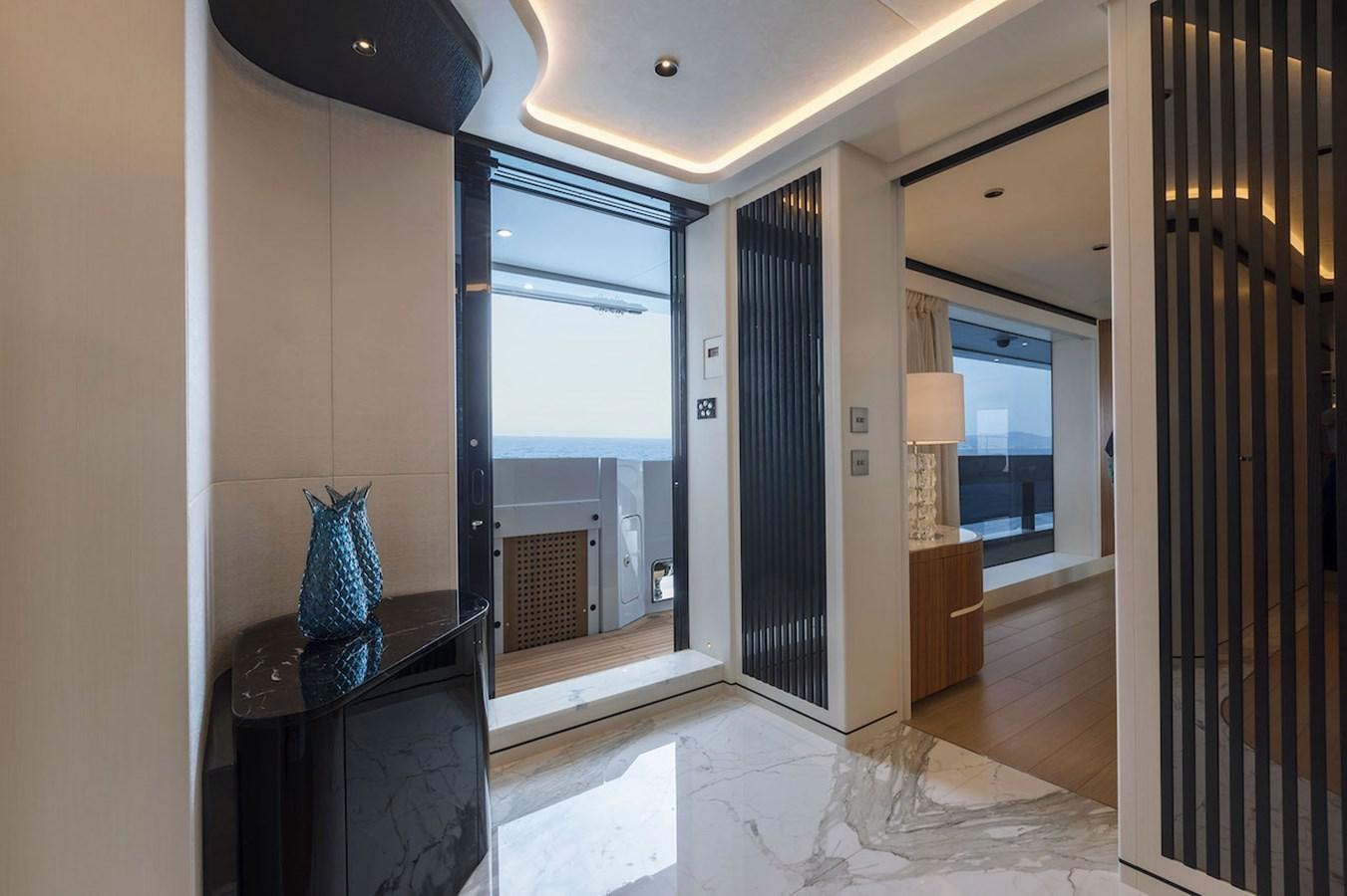 a living room with a fireplace aboard MAVERICK Yacht for Sale