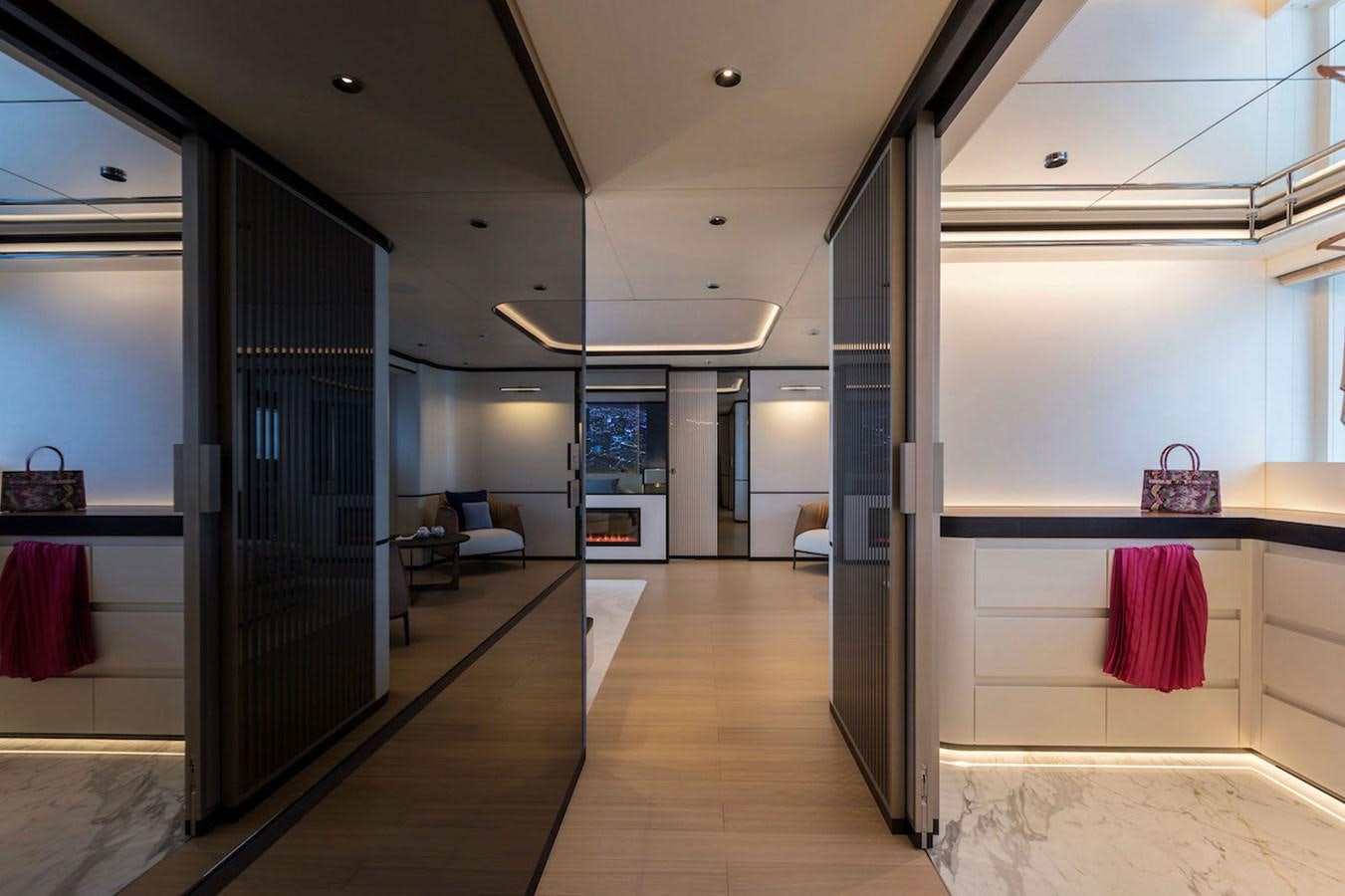 a room with a wood floor and a glass door aboard MAVERICK Yacht for Sale