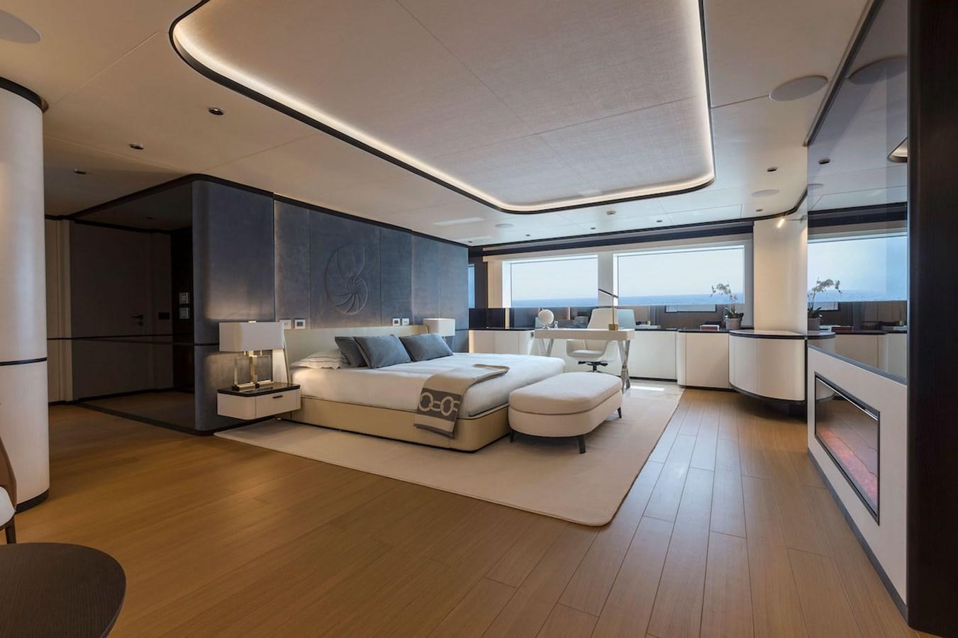 a modern living room with a large window aboard MAVERICK Yacht for Sale