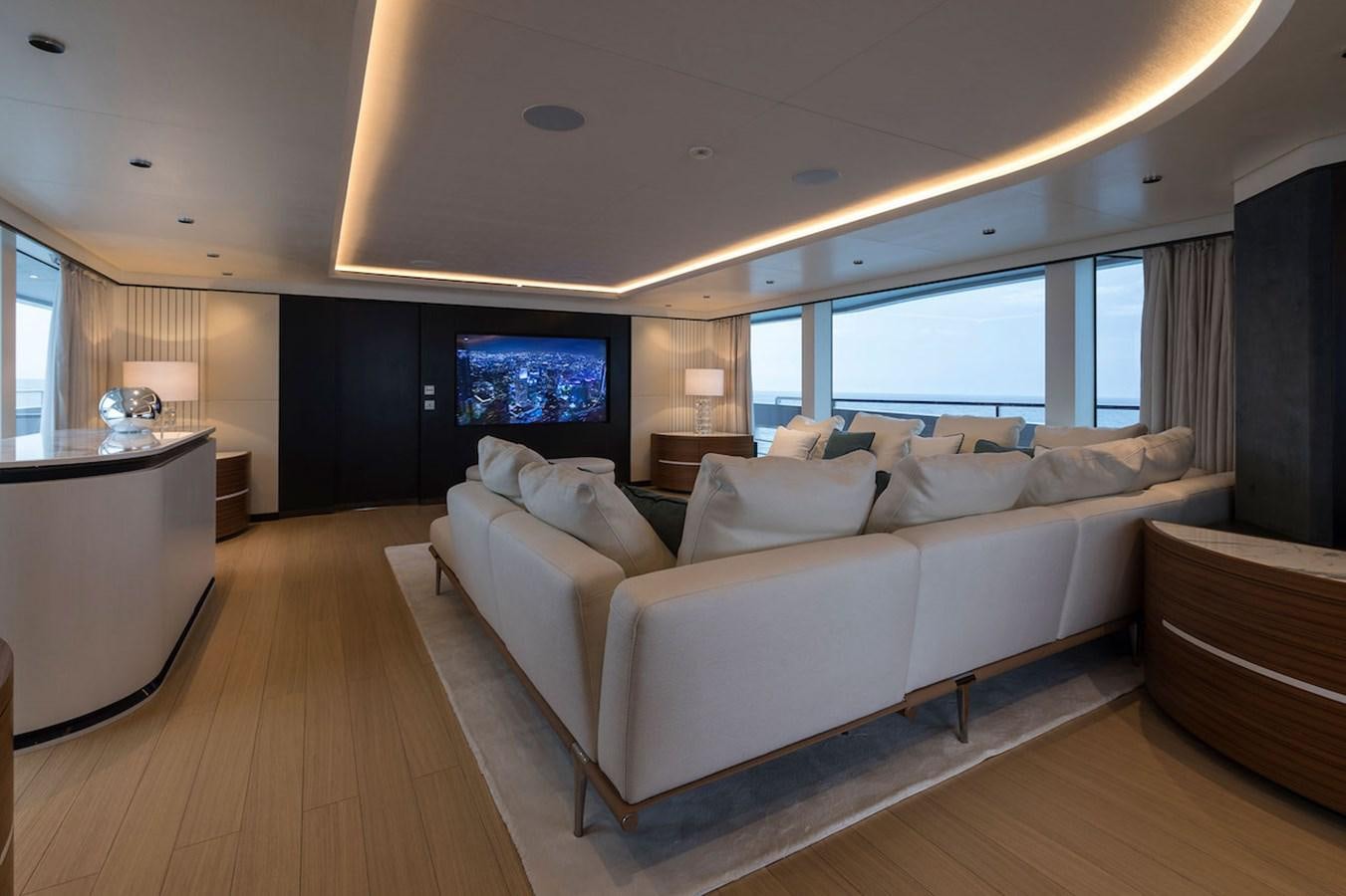 a large living room with a large window aboard MAVERICK Yacht for Sale