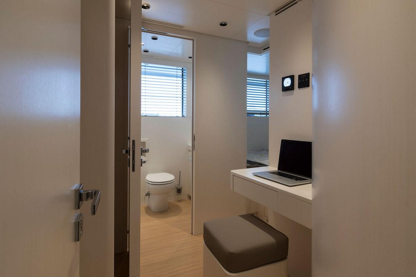 a bathroom with a laptop on the counter aboard MAVERICK Yacht for Sale