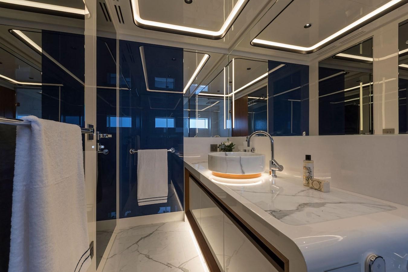 a bathroom with a sink and a mirror aboard MAVERICK Yacht for Sale