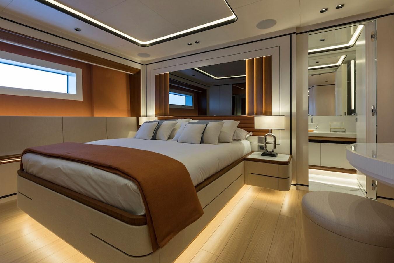 a room with a bed and a desk aboard MAVERICK Yacht for Sale