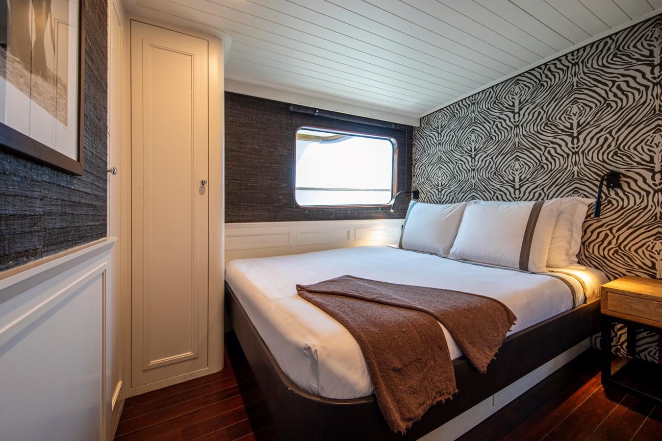 a bed with a pillow aboard SANTA MARIA Yacht for Sale