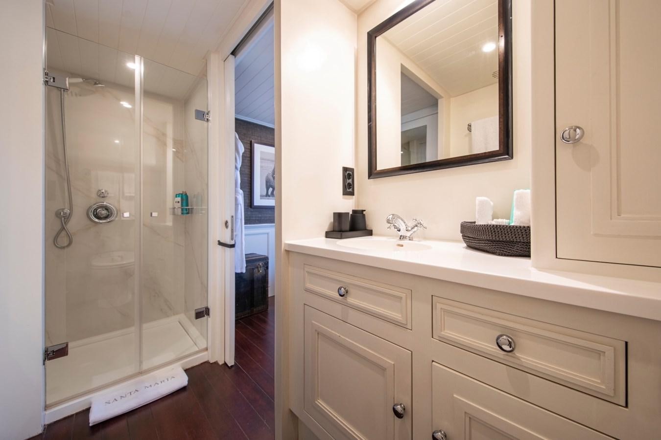 a bathroom with a glass shower aboard SANTA MARIA Yacht for Sale