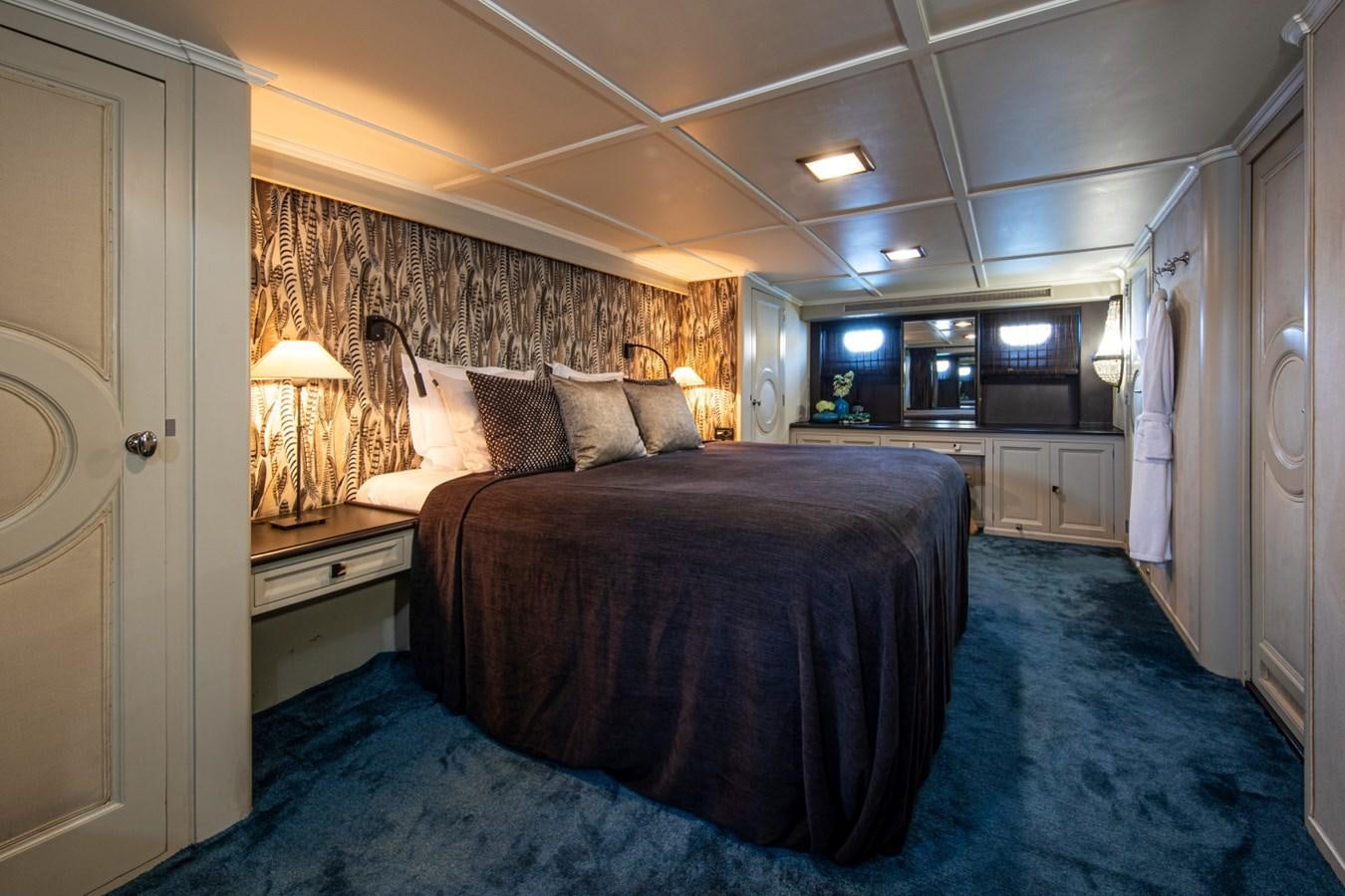 a bed in a room aboard SANTA MARIA Yacht for Sale