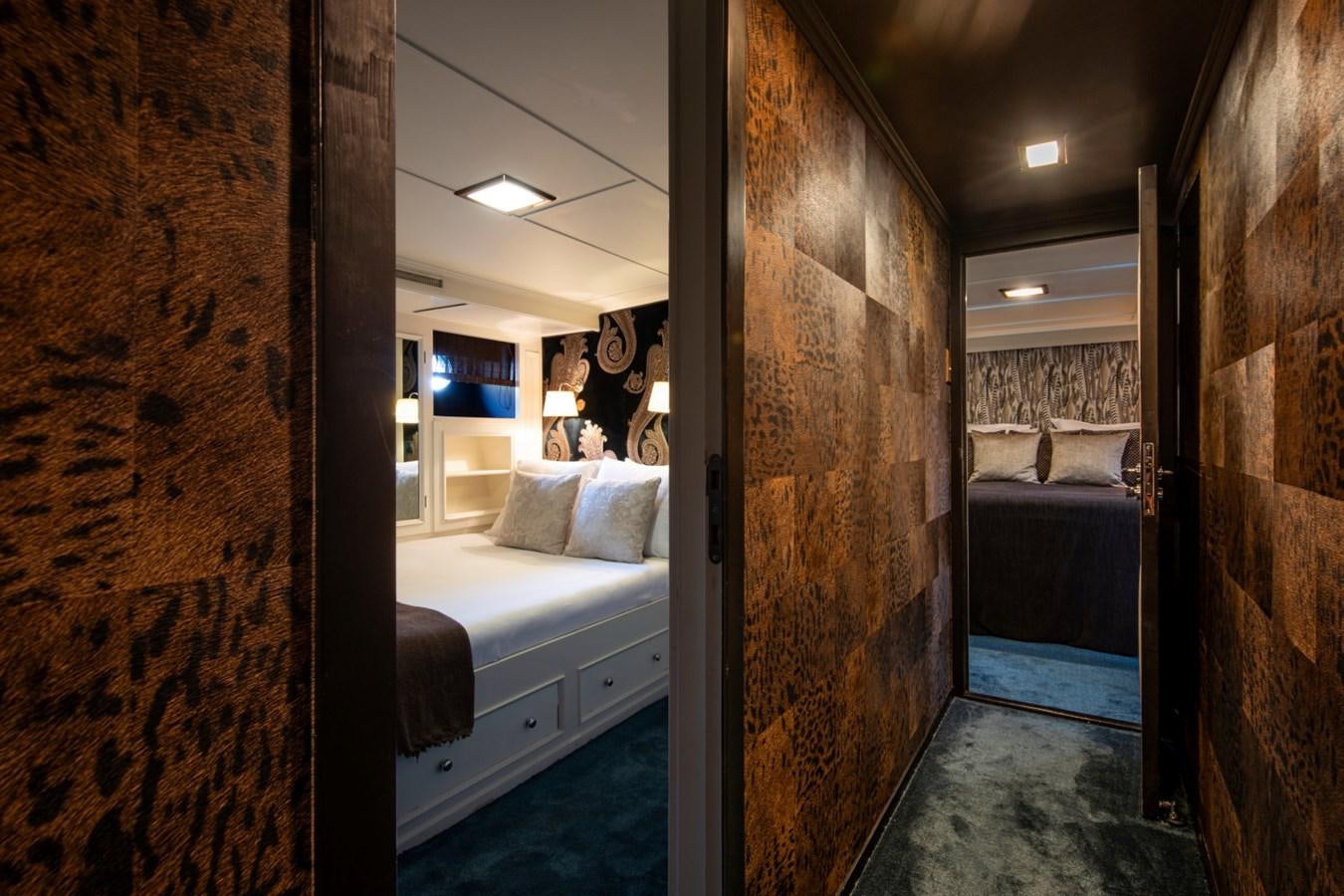 a room with a bed and a mirror aboard SANTA MARIA Yacht for Sale